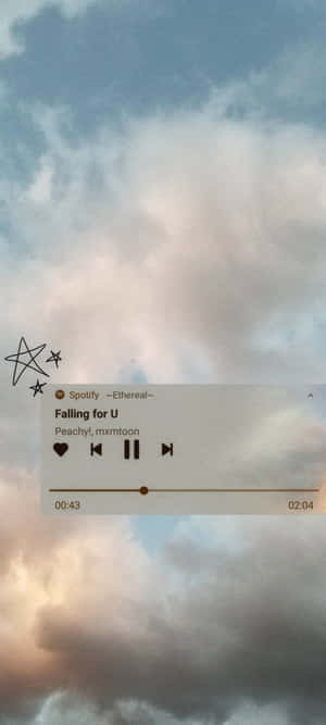在雲朵天空背景上帶有手繪星星的 Spotify 音樂播放器。 — 美學音樂 壁紙
