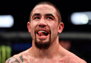八角籠中一名滿臉鮮血、張開嘴巴的勝利MMA戰士。 — 運動 壁紙