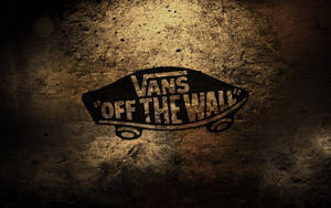 Vans Off The Wall標誌在粗糙的混凝土牆上，帶有聚光燈效果。 — 標誌 壁紙