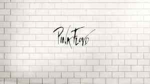 白色磚牆上黑色草書的Pink Floyd標誌。 — 可愛又粉嫩 壁紙