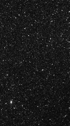 黑色背景覆蓋白色亮粉顆粒，營造閃爍效果。 — 星星 壁紙