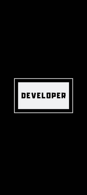 黑色背景上有一個白色矩形，內含粗體黑色文字 developer — 20:9 壁紙