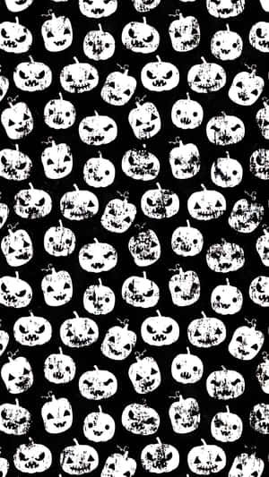 黑白萬聖節南瓜圖案，帶有粗糙質感。 — Marshmello iPhone 壁紙