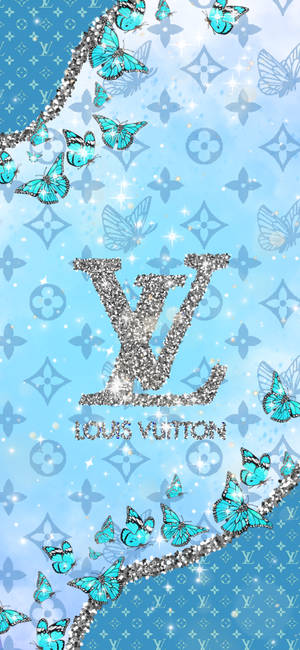 綠松石色蝴蝶在藍色圖案背景上圍繞閃閃發光的 Louis Vuitton 標誌飛舞。 — iPhone 16e 壁紙