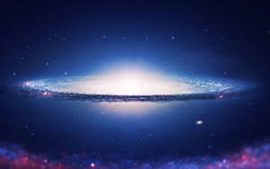 在黑暗星空背景下，一個帶有藍色和白色色調的發光螺旋星系。 — 宇宙 壁紙