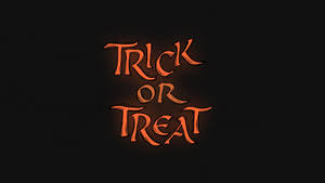 在黑色背景上，發光的橙色萬聖節文字寫著 Trick or Treat。 — 霓虹橘 壁紙