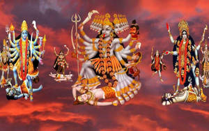 擁有許多手臂和武器的印度教神靈在火紅的天空中。 — Maa Durga 壁紙