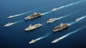軍用航空母艦及護航艦在公海編隊航行。