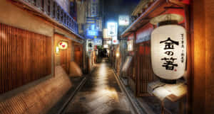 夜晚狹窄的日本小巷，被發光的燈籠和霓虹燈招牌照亮。 — 日本 壁紙