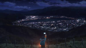 山頂上的人正在星空下拍攝夜晚閃爍的城市照片 — 夜晚 壁紙