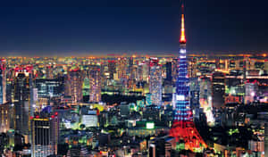 夜晚點亮的東京塔，下方城市燈光閃爍。 — 東京喰種風格 壁紙