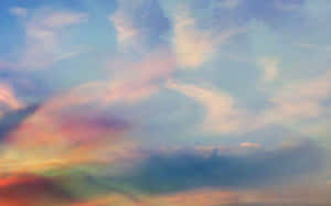 柔和的粉彩雲朵在黃昏時散發出粉紅、橙色和藍色的光芒。 — 美學天空 壁紙