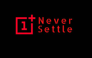 紅色 OnePlus 標誌和標語在黑色背景上。 — 一加 壁紙