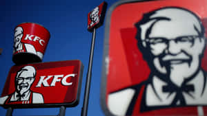 KFC餐廳招牌，帶有桑德斯上校標誌，背景為藍天 — 肯德基 壁紙
