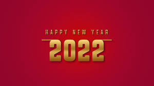 金色文字在紅色背景上寫著 Happy New Year 2022。 — iMac 壁紙