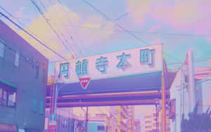 在粉彩天空下，色彩繽紛的城市街道，有日本招牌和建築物。 — 藍色美學電腦 壁紙
