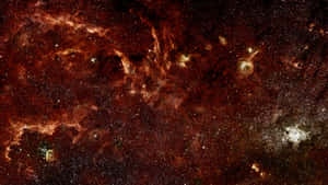 在深空中無數恆星之間發光的火熱橙色和紅色星雲雲團。 — 太空美學動圖 壁紙