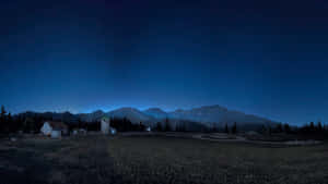 星空下，山巒背景中一個安靜的村莊夜晚。 — 極地戰嚎5 壁紙