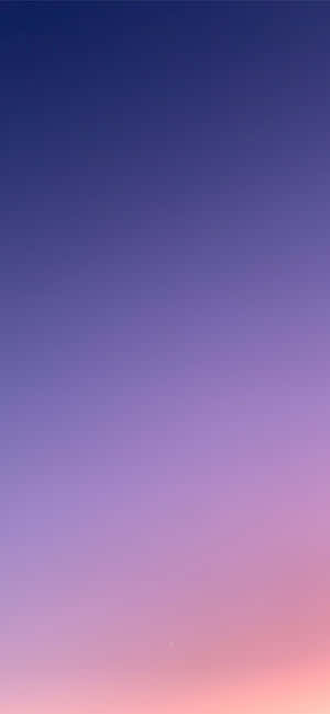 從藍色漸變到粉紅色的天空，帶有月牙 — Pixel 9 Pro XL 壁紙
