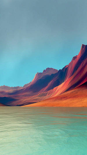 平靜的藍綠色湖泊反射出日落時分色彩繽紛的山脈。 — 山坡 壁紙