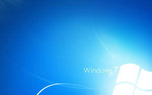 Windows 7 作業系統標誌在藍色漸層背景上，帶有發光的漩渦。 — 藍色美學電腦 壁紙