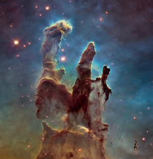在太空中發光的氣體和塵埃柱，伴隨著明亮的星星。 — 太空 壁紙