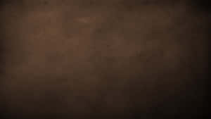 深棕色紋理復古紙張背景，帶有細微顆粒和斑點。 — 簡約暗黑美學 壁紙