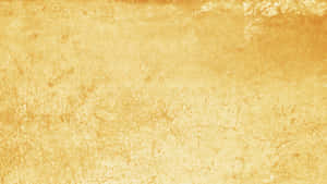 帶有細微裂紋和不均勻表面細節的金色紋理牆壁。 — 黃色美學 GIF 壁紙