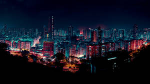 充滿活力的夜景城市景觀，建築物發光，天空黑暗。 — 城市風景 壁紙