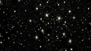 黑色背景上充滿發光金色星星的星空夜晚。 — 夜空 壁紙