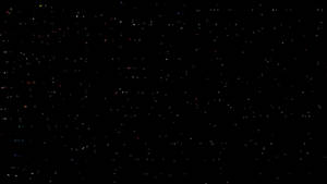 繁星點點的夜空，充滿了色彩繽紛的閃爍星星，背景為黑色。 — 4K 光環 壁紙