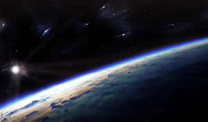 從太空看到的地球，帶有發光的大氣層和星空。 — 太空 壁紙
