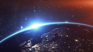 日出時的地球，閃爍的城市和星空 — 地平線：黎明時分 壁紙