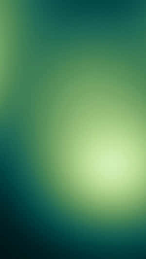 綠色和藍綠色調的柔和發光漸變。 — 翡翠綠 壁紙