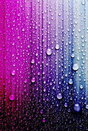玻璃上的雨滴，背景為洋紅色到青色漸變 — 酷 壁紙