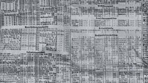 黑白復古德國股票行情紙帶，帶有密集的財務數據。 — Old Paper 壁紙