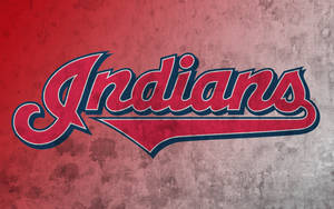 紅色和藍色的 Indians 棒球標誌在紋理牆壁上。 — 克里夫蘭騎士隊 壁紙