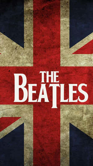 風化 Union Jack 旗幟，帶有白色 The Beatles 文字。 — 披頭四 壁紙