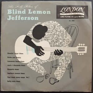 Blind Lemon Jefferson 的民謠藍調唱片專輯封面，特色是坐著的吉他手剪影。 — 專輯封面 壁紙