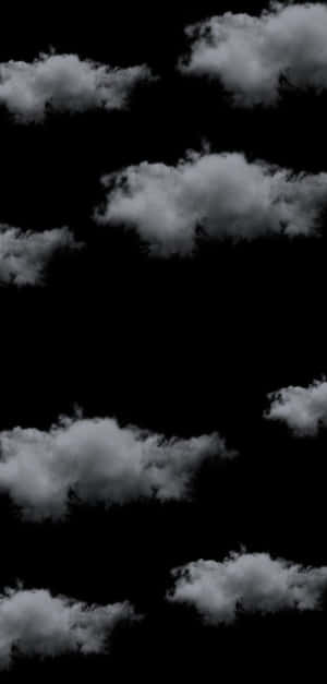 黑色天空上漂浮的白雲，極簡抽象設計。 — 美學天空 壁紙