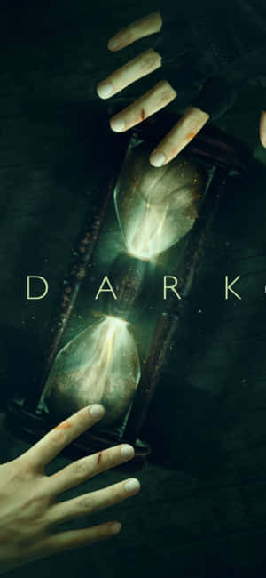 手拿著一個發光的沙漏，下方寫著dark一詞。 — iPhone 17 壁紙