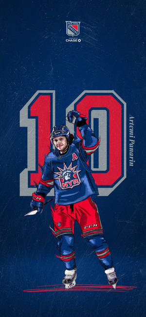 冰球運動員 Artemi Panarin 身穿遊騎兵隊裝備，舉起球棒慶祝。 — 運動 壁紙