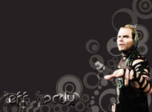 摔角手 Jeff Hardy 在灰色圓形背景上向前指。 — 黑白小丑 壁紙