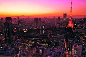 日落時分的東京城市景觀，東京塔亮起，遠處的富士山。 — 東京 壁紙