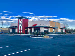 KFC餐廳，桑德斯上校畫像，藍天白雲下。 — 肯德基 壁紙