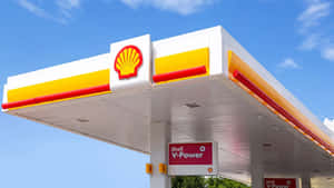 晴朗藍天下的Shell加油站頂篷，帶有V-Power標誌。 — 瓦斯 壁紙