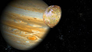 木星及其衛星伊奧在繁星點點的宇宙中運行。 — 高畫質月亮 壁紙