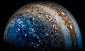 木星在太空中旋轉的藍色和棕色風暴 — 木星 GIF 壁紙
