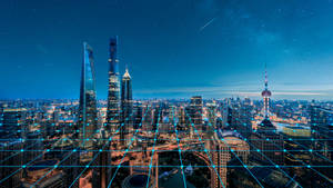 未來城市夜景，閃爍的建築物和數位網格覆蓋。 — 中國 壁紙
