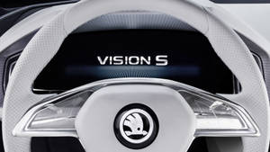 未來感汽車方向盤特寫，帶有 Vision S 顯示螢幕。 — 天蠍座美學 壁紙